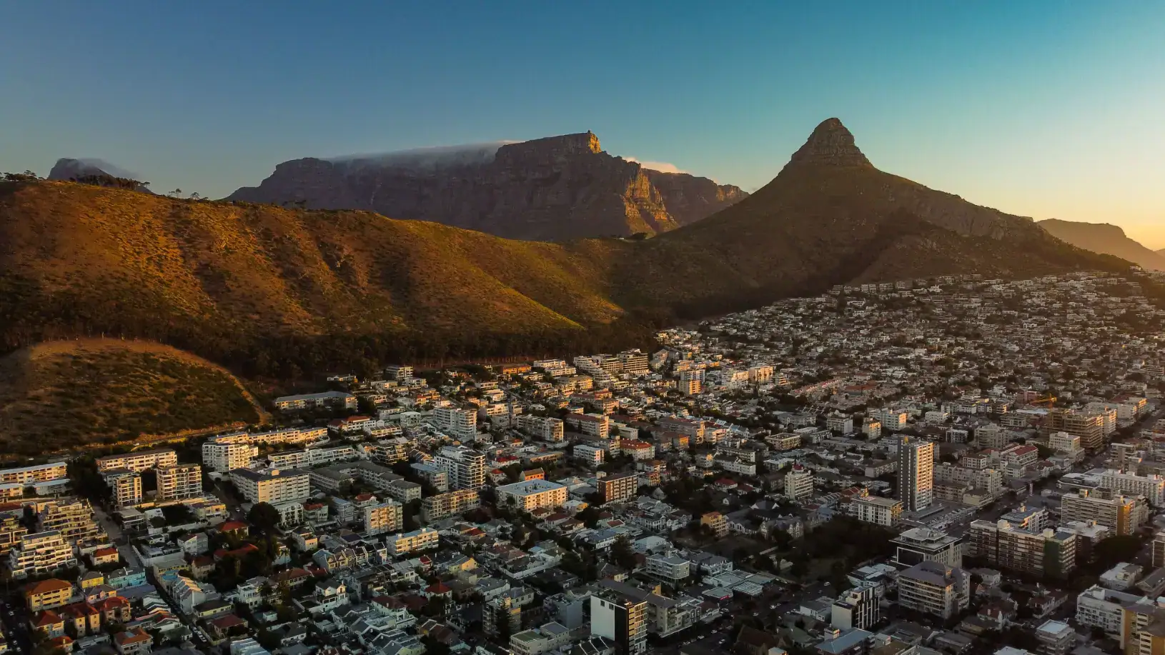 Cape Town with mountains at sunset. Investment Focus